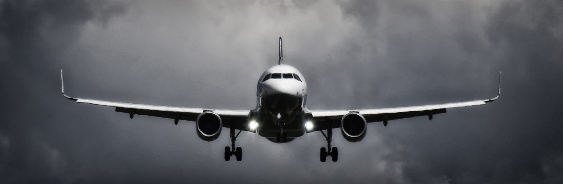 photo of a plane arriving at an airport. this symbolizes the arrival of a person when they achieve their goal using the goal setting cycle as guided by their leader.
